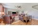 Cozy living room with ample seating, natural light, and a ceiling fan at 109 Cypress Plantation Rd, Moncks Corner, SC 29461