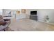 Comfortable carpeted loft with a large television, plant, and leather seating area, perfect for relaxation and entertainment at 109 Cypress Plantation Rd, Moncks Corner, SC 29461