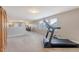 Bright loft featuring a treadmill for exercise and comfortable seating, perfect for a home gym and entertainment at 109 Cypress Plantation Rd, Moncks Corner, SC 29461