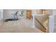 Loft with a treadmill, cabinet, and carpeted floor, creating a versatile and functional living area at 109 Cypress Plantation Rd, Moncks Corner, SC 29461