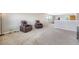 Spacious carpeted loft area featuring comfortable leather recliners and ample natural light from the windows at 109 Cypress Plantation Rd, Moncks Corner, SC 29461