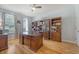 Spacious office with custom wooden built-ins, offering a dedicated workspace for productivity at 109 Cypress Plantation Rd, Moncks Corner, SC 29461