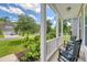Inviting front porch with comfortable seating, offering serene views of the neighborhood at 109 Cypress Plantation Rd, Moncks Corner, SC 29461