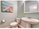 Stylish powder room featuring a pedestal sink, modern fixtures, and tasteful decor at 109 Cypress Plantation Rd, Moncks Corner, SC 29461