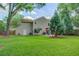 The exterior of this home features a lawn and access to the back of the residence at 110 Bayberry Run, Summerville, SC 29485