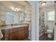 This bathroom features granite countertop, wood cabinetry and a shower at 110 Bayberry Run, Summerville, SC 29485