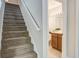 Stairway with view of bathroom featuring vanity and soft neutral coloring at 110 Bayberry Run, Summerville, SC 29485