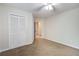 This bedroom features neutral carpet, a closet with paneled doors and a ceiling fan at 110 Bayberry Run, Summerville, SC 29485