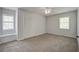 This carpeted bedroom features a ceiling fan, window, and closet at 110 Bayberry Run, Summerville, SC 29485