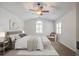Bright primary bedroom with neutral tones, ceiling fan, and stylish decor at 110 Bayberry Run, Summerville, SC 29485