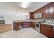 Gourmet kitchen with stainless steel appliances, breakfast bar, and tile floors at 110 Bayberry Run, Summerville, SC 29485