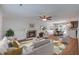 Bright living room features a fireplace, modern furniture, and seamless flow to the dining and kitchen areas at 110 Bayberry Run, Summerville, SC 29485