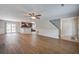 Open concept living room with wood floors flows into a modern kitchen and dining area at 110 Bayberry Run, Summerville, SC 29485