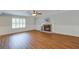 Bright and spacious living room features a fireplace, wood flooring and great natural light at 110 Bayberry Run, Summerville, SC 29485