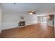 Spacious living room with a fireplace, wood flooring and a sliding door to the backyard at 110 Bayberry Run, Summerville, SC 29485