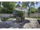 Backyard patio with an umbrella and seating, perfect for outdoor dining and relaxation at 112 Lewisfield Dr, North Charleston, SC 29418