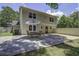 An outdoor patio boasts a table set and open layout at 112 Lewisfield Dr, North Charleston, SC 29418