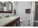 Neutral colored bathroom features a granite countertop, a sink, and a mirror at 112 Lewisfield Dr, North Charleston, SC 29418