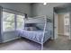 Bright bedroom with a bunk bed, large window, and soothing blue accents for a comfortable space at 112 Lewisfield Dr, North Charleston, SC 29418