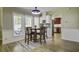 Bright breakfast nook with natural light and backyard access sits adjacent to the kitchen at 112 Lewisfield Dr, North Charleston, SC 29418