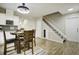 Cozy dining area features a modern light fixture and staircase leading to the upper level at 112 Lewisfield Dr, North Charleston, SC 29418