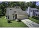 This charming single-Gathering home has an attached garage and lush front lawn at 112 Lewisfield Dr, North Charleston, SC 29418