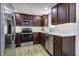 Updated kitchen features stainless steel appliances, modern countertops, and ample cabinet space at 112 Lewisfield Dr, North Charleston, SC 29418