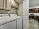Laundry room with washer and dryer next to a kitchen space at 112 Lewisfield Dr, North Charleston, SC 29418