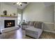 Relaxing living room featuring a decorative fireplace and a comfortable sectional sofa at 112 Lewisfield Dr, North Charleston, SC 29418