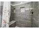 Tiled shower with a built-in bench and shower niche for toiletries at 112 Lewisfield Dr, North Charleston, SC 29418