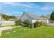 Backyard with picket fence, green grass, and a charming view of the home at 113 Amaranth Ave, Summerville, SC 29483