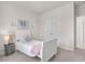 This bedroom is well lit and features a closet, a bed with decor, and an open doorway at 113 Amaranth Ave, Summerville, SC 29483