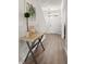 Stylish entryway with a rustic table, decor, and elegant lighting fixture at 113 Amaranth Ave, Summerville, SC 29483