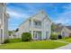 Charming two-story home with a porch, balcony, and well-maintained lawn at 113 Amaranth Ave, Summerville, SC 29483