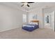 Cozy main bedroom boasts a comfortable bed, ceiling fan, and ample natural light from the large window at 113 Amaranth Ave, Summerville, SC 29483