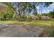 Spacious backyard featuring a large tree, a grassy area, and a concrete patio at 113 Harvey Ave, Goose Creek, SC 29445