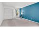 A bedroom with blue accent wall and window at 1136 Shadow Lake Cir, Mount Pleasant, SC 29464