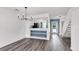 Open dining room featuring hardwood floors, stylish chandelier and open view to the kitchen at 1136 Shadow Lake Cir, Mount Pleasant, SC 29464
