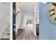 View of the foyer with wooden floors, staircase, decor and view of backyard through sliding doors at 1136 Shadow Lake Cir, Mount Pleasant, SC 29464