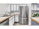 Modern kitchen with stainless steel appliances, white cabinetry, and contrasting countertops at 1136 Shadow Lake Cir, Mount Pleasant, SC 29464