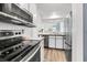 Bright kitchen showcasing modern appliances, a wood counter, and open view to the adjacent rooms at 1136 Shadow Lake Cir, Mount Pleasant, SC 29464