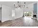 Bright living room with fireplace, vaulted ceilings, hardwood floors, and sliding glass doors to the backyard at 1136 Shadow Lake Cir, Mount Pleasant, SC 29464