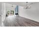 Spacious living room with fireplace, ceiling fan, sliding glass doors, and hardwood floors at 1136 Shadow Lake Cir, Mount Pleasant, SC 29464