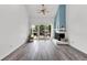 Bright living room with fireplace, ceiling fan and sliding glass doors leading to a fenced patio at 1136 Shadow Lake Cir, Mount Pleasant, SC 29464