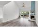 Bright living room featuring a vaulted ceiling, fireplace, and sliding doors to a deck at 1136 Shadow Lake Cir, Mount Pleasant, SC 29464