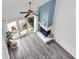 Bright living room featuring stylish gray floors, a cozy fireplace, and sliding glass doors to the patio at 1136 Shadow Lake Cir, Mount Pleasant, SC 29464