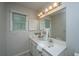 Bright bathroom features double sinks, a large mirror, and modern lighting at 115 W Park Ln, Summerville, SC 29486