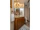 Bathroom featuring a vanity with a large mirror, flowers and other decor on the counter at 115 W Park Ln, Summerville, SC 29486