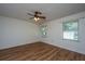 Spacious bedroom with a ceiling fan, wood-look laminate flooring and natural light at 115 W Park Ln, Summerville, SC 29486