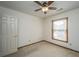 Bedroom featuring a ceiling fan, neutral carpet, a window and a closet at 115 W Park Ln, Summerville, SC 29486